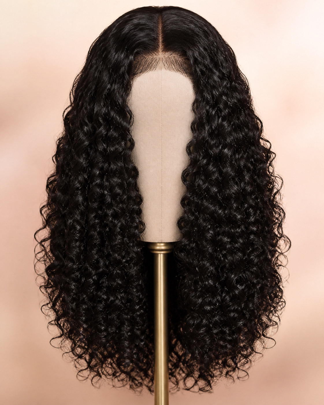 Defined curly human-hair wig on a studio stand