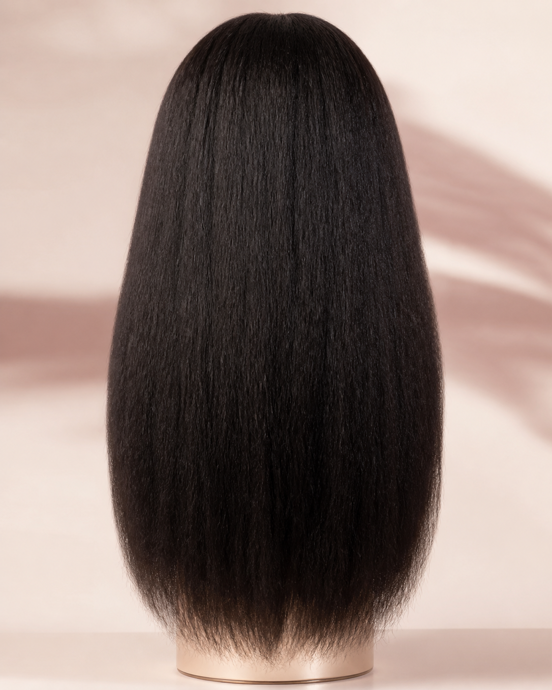 Back view of a naturally textured kinky-straight human-hair wig